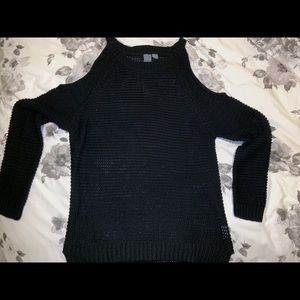 Francesca’s black sweater with shoulder cutouts